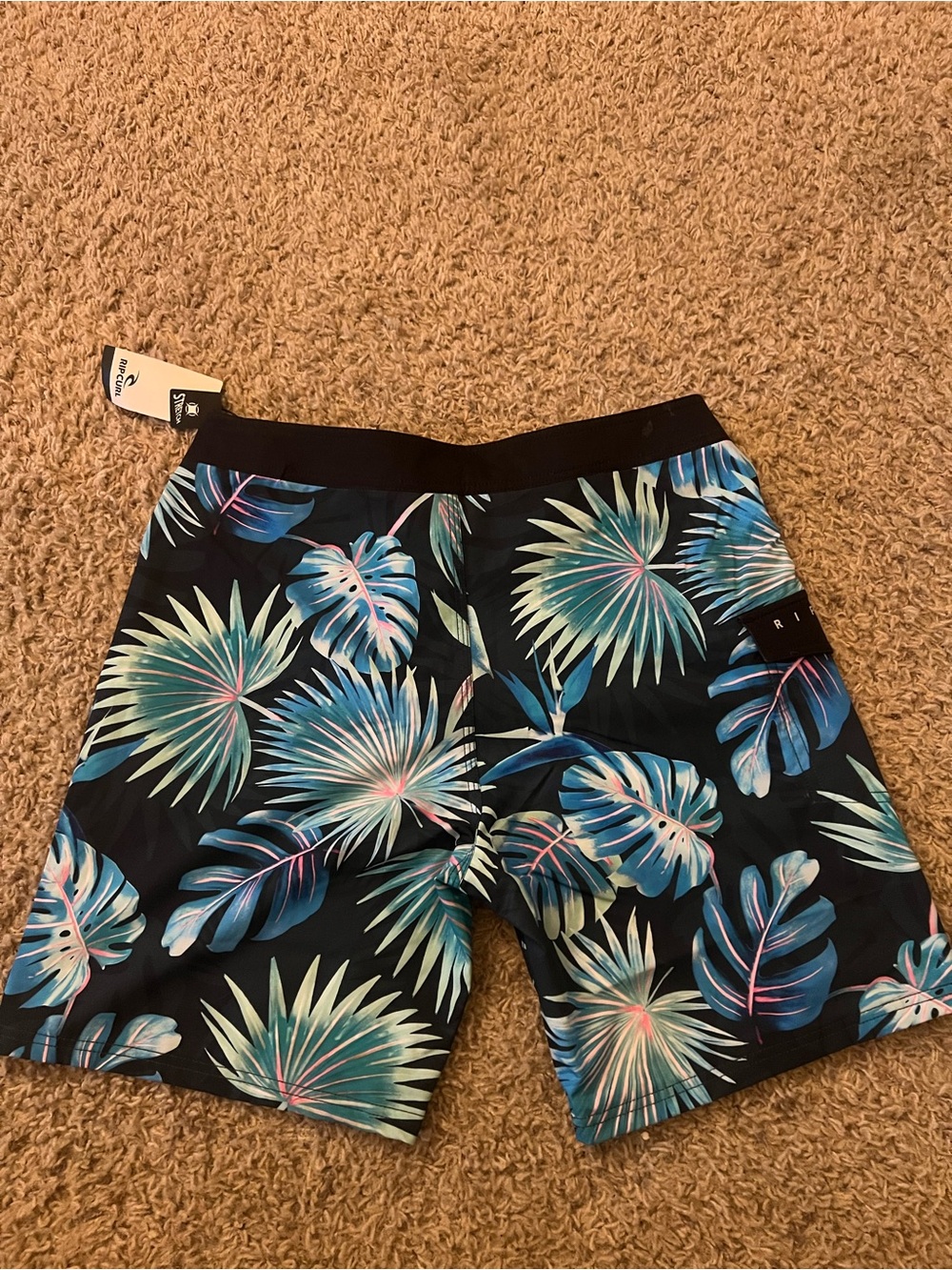 Rip Curl Black Swim Shorts with Blue-Green Tropical Leaves